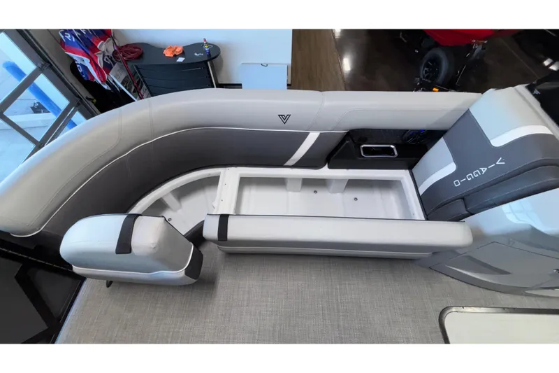Slide: The Image of 2026 Viaggio Z24U boat interior with gray seating and storage compartment. - 14