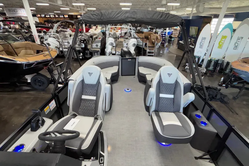 Slide: The Image of 2026 Viaggio Z24U pontoon boat interior with modern seating and steering wheel. - 19