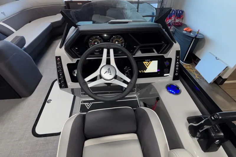 Slide: The Image of 2026 Viaggio Z24U boat dashboard with steering wheel and modern controls. - 22