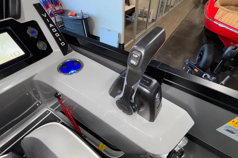 Slide: The Image of Control panel of 2026 Viaggio Z24U boat with throttle lever and blue LED cup holder. - 23