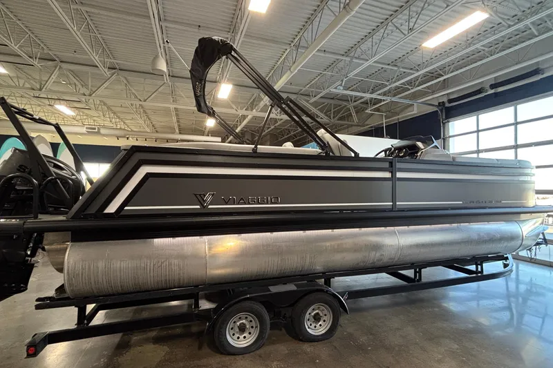 Slide: The Image of 2026 Viaggio Z24U pontoon boat on trailer in indoor showroom. - 4