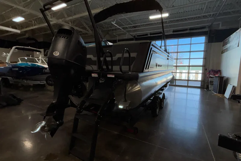 Slide: The Image of 2026 Viaggio Z24U pontoon boat in a showroom with powerful outboard motor. - 53