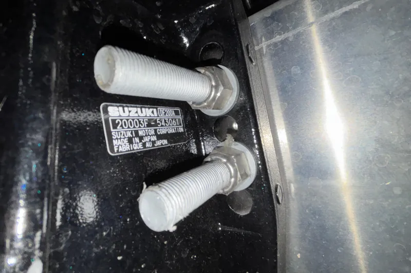 Slide: The Image of Close-up of Suzuki motor bolts and label on Viaggio Z24U, 2026 model. - 55