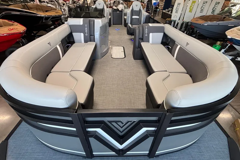 Slide: The Image of 2026 Viaggio Z24U pontoon boat with spacious seating and modern design in showroom. - 7