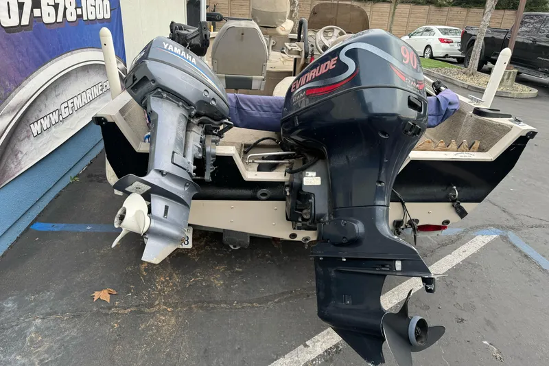 Slide: The Image of 2000 Crestliner 1650 Fish Hawk with Yamaha and Evinrude outboard motors. - 4