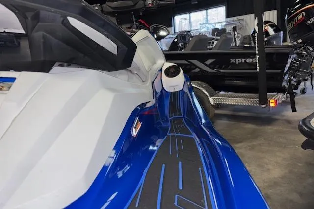 Slide: The Image of 2023 Yamaha WaveRunner VX Limited in showroom, featuring sleek blue and white design. - 10