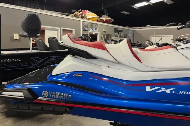 Slide: The Image of 2023 Yamaha WaveRunner VX Limited in showroom, featuring sleek blue and white design. - 3