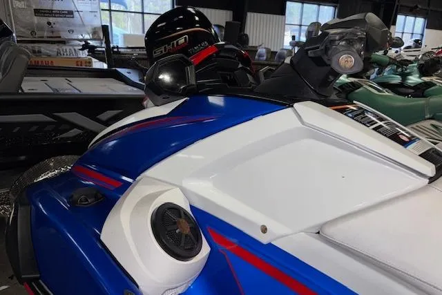 Slide: The Image of 2023 Yamaha WaveRunner VX Limited in showroom, featuring sleek blue and white design. - 6