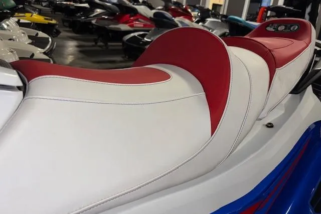 Slide: The Image of 2023 Yamaha WaveRunner VX Limited with red and white seating in showroom. - 7