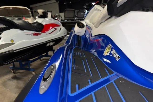 Slide: The Image of 2023 Yamaha WaveRunner VX Limited in showroom, featuring sleek blue and white design. - 9