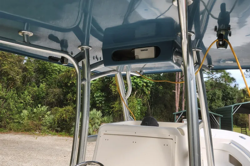 Slide: The Image of 2013 Panga Center Console boat interior with canopy and equipment. - 12