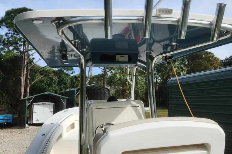 Slide: The Image of 2013 Panga Center Console boat with T-top in outdoor storage. - 18