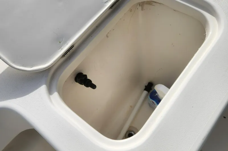 Slide: The Image of Open storage compartment in a 2013 Panga Center Console boat. - 19