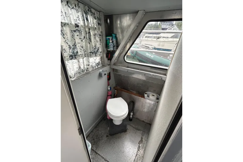 Slide: The Image of Steering wheel of 1994 Svendsen Marine Works SMW 38 boat docked at marina. - 15