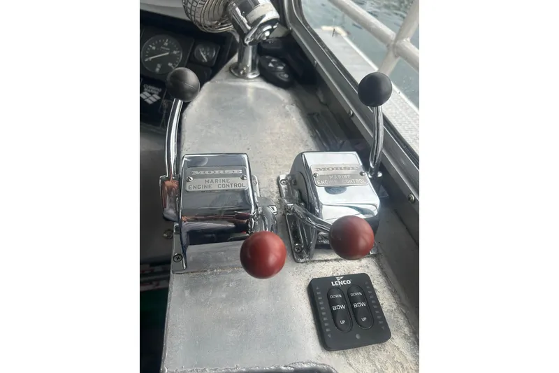 Slide: The Image of Control panel of a 1994 Svendsen Marine Works SMW 38 boat with Morse engine controls. - 23