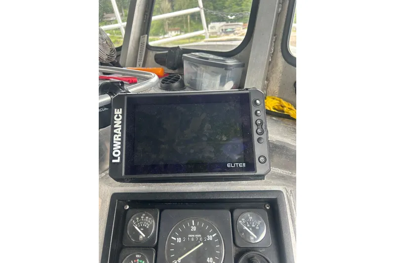 Slide: The Image of Boat dashboard with Lowrance Elite GPS on Svendsen Marine Works SMW 38, 1994 model. - 28