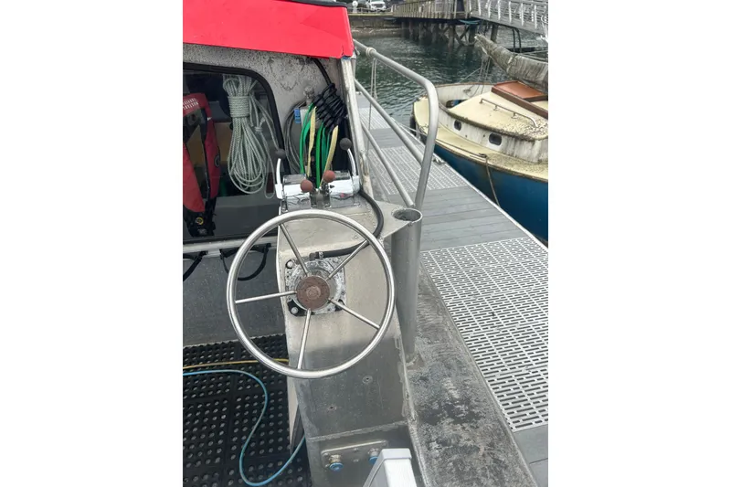 Slide: The Image of Custom SMW 38 boat cabin, 1994 model, with metal exterior and red accents. - 3