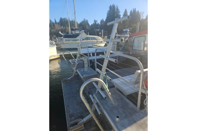 Slide: The Image of Custom SMW 38 boat docked at marina, 1994 model, with metal framework and nearby vessels. - 33