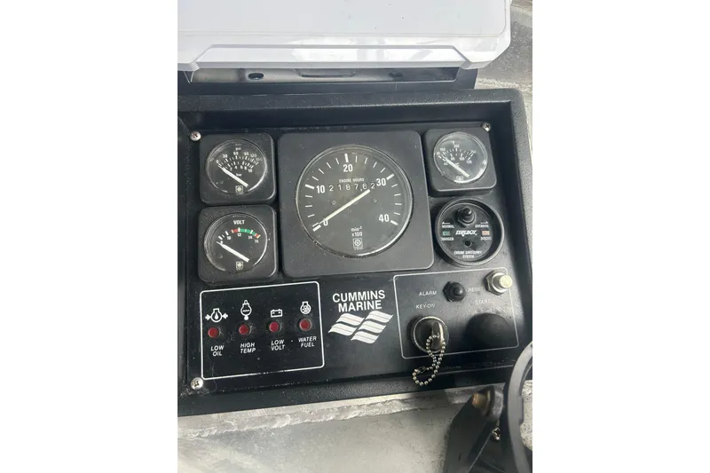 Slide: The Image of Interior of a 1994 Custom SMW 38 boat cockpit with steering wheel and control panels. - 7