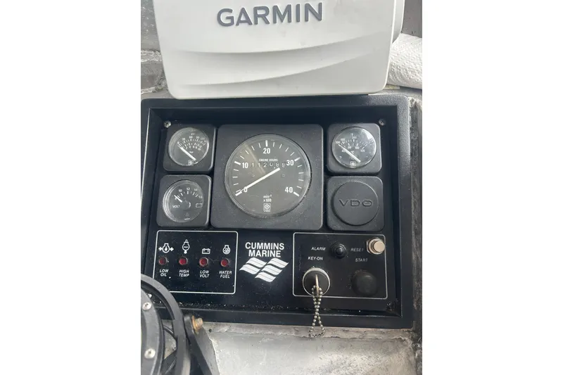 Slide: The Image of Interior of a 1994 Custom SMW 38 boat cockpit with steering wheel and control panels. - 8