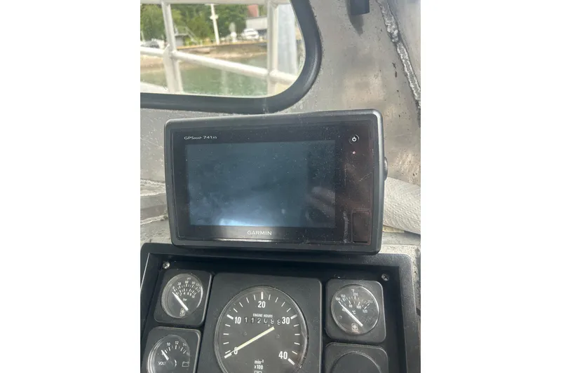 Slide: The Image of Interior of a 1994 Custom SMW 38 boat with seating and control area. - 9