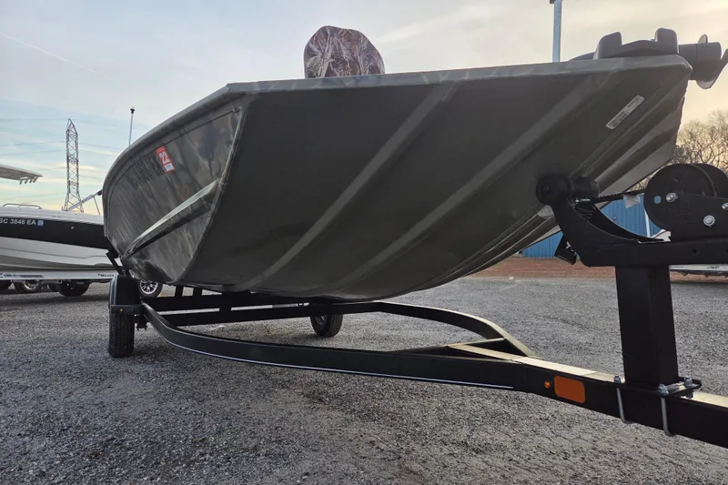 Slide: The Image of 2018 Tracker Grizzly 1860 CC boat on trailer, parked outdoors. - 3