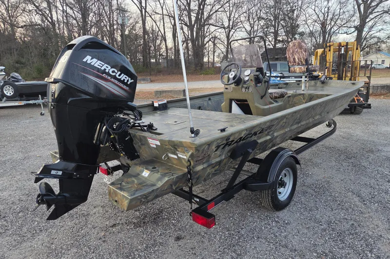 Slide: The Image of 2018 Tracker Grizzly 1860 CC boat with Mercury outboard motor on trailer. - 5