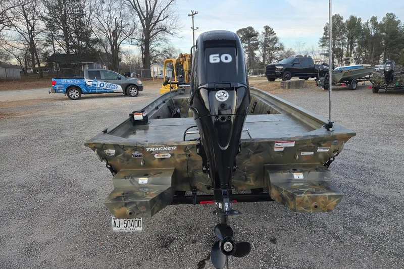 Slide: The Image of 2018 Tracker Grizzly 1860 CC boat with camo design and 60 HP outboard motor. - 6