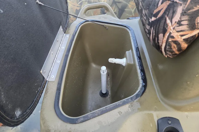 Slide: The Image of Open storage compartment in 2018 Tracker Grizzly 1860 CC boat. - 9