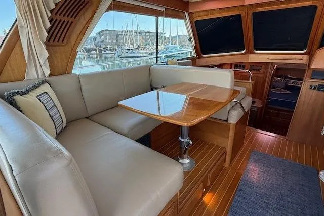 Slide: The Image of Luxurious interior of 2013 Sabre 38 Salon Express yacht with elegant seating and wooden finishes. - 11