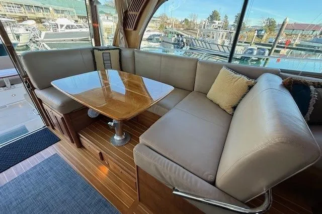 Slide: The Image of Luxurious interior of 2013 Sabre 38 Salon Express with plush seating and wooden table. - 12