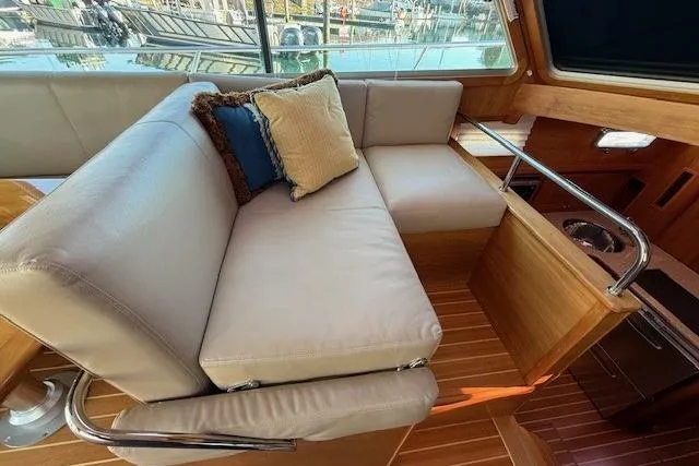 Slide: The Image of Luxurious interior of 2013 Sabre 38 Salon Express yacht with plush seating and cushions. - 14