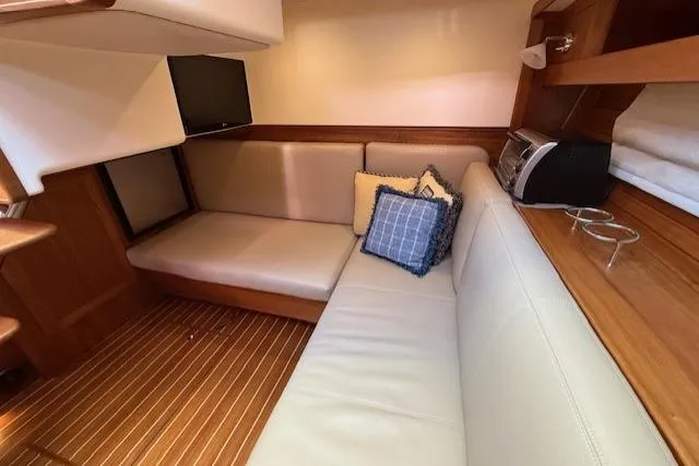 Slide: The Image of Interior of 2013 Sabre 38 Salon Express with cozy seating and wooden accents. - 23