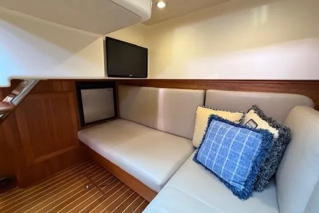 Slide: The Image of Interior of 2013 Sabre 38 Salon Express with cozy seating and decorative pillows. - 25