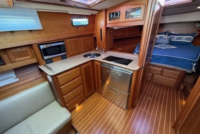 Slide: The Image of Interior of 2013 Sabre 38 Salon Express yacht with kitchen and bedroom. - 26