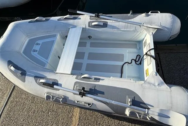 Slide: The Image of Inflatable boat with oars, docked; Sabre 38 Salon Express, 2013 model. - 40