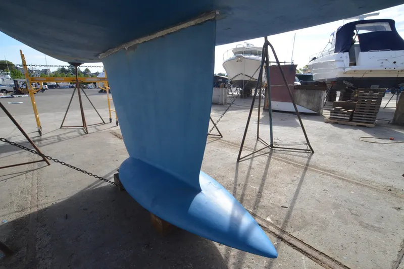 Slide: The Image of Keel of a 1999 Jeanneau Sun Odyssey 45.2 sailboat in a boatyard. - 10