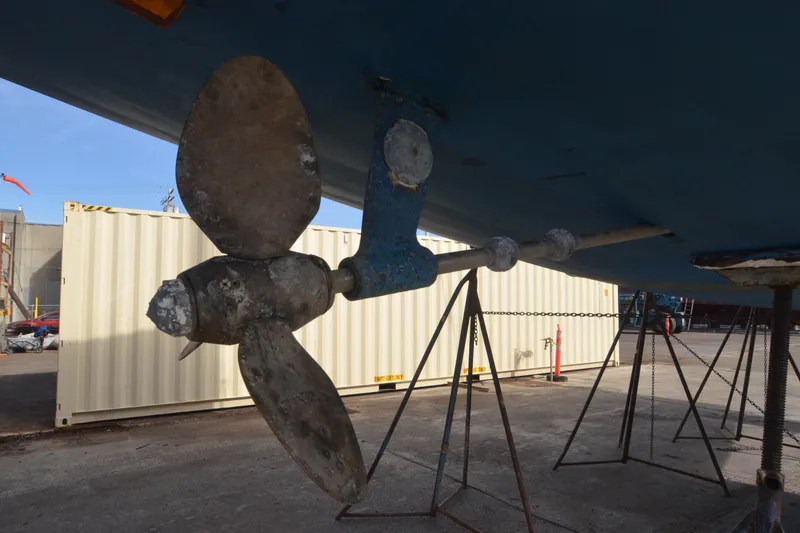 Slide: The Image of Propeller of 1999 Jeanneau Sun Odyssey 45.2 sailboat on dry dock. - 13