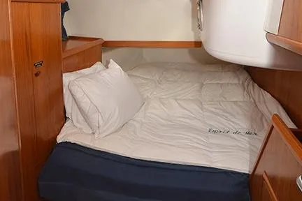 Slide: The Image of Cozy cabin interior of 1999 Jeanneau Sun Odyssey 45.2 sailboat with wooden furnishings. - 25