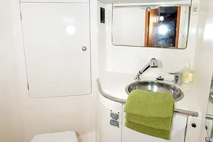 Slide: The Image of Bathroom interior of 1999 Jeanneau Sun Odyssey 45.2 yacht with sink and mirror. - 27