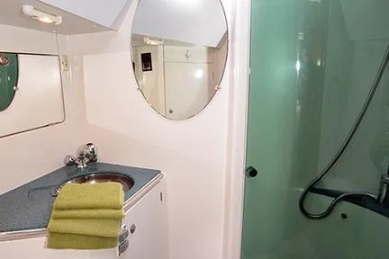 Slide: The Image of Bathroom interior of 1999 Jeanneau Sun Odyssey 45.2 yacht with sink and shower. - 28