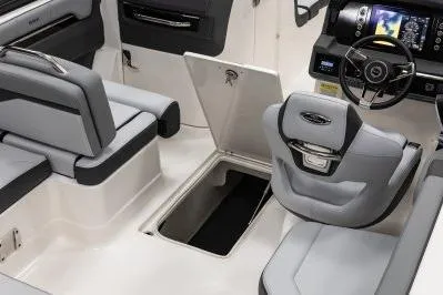Slide: The Image of 2026 Chaparral SSX 4 boat interior with modern seating and storage compartment. - 14