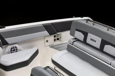 Slide: The Image of 2026 Chaparral SSX 4 boat interior with gray seating and control panel. - 18