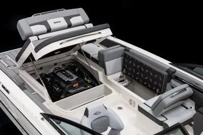 Slide: The Image of 2026 Chaparral SSX 4 boat interior with engine compartment open, showcasing seating and design. - 19