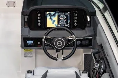 Slide: The Image of 2026 Chaparral SSX 4 boat dashboard with modern steering and navigation display. - 3