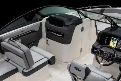 Slide: The Image of 2026 Chaparral SSX 4 boat interior with modern dashboard and seating. - 6