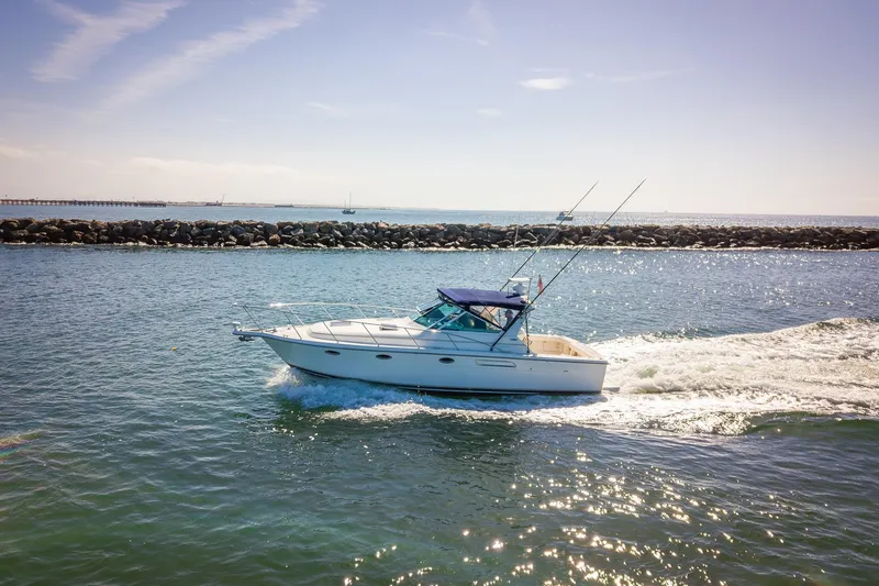 Slide: The Image of 2000 Tiara 31 Open yacht cruising on sunny ocean waters. - 39