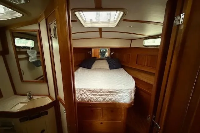 Slide: The Image of Interior of 2001 Sabreline Sedan with cozy bedroom and wooden furnishings. - 37