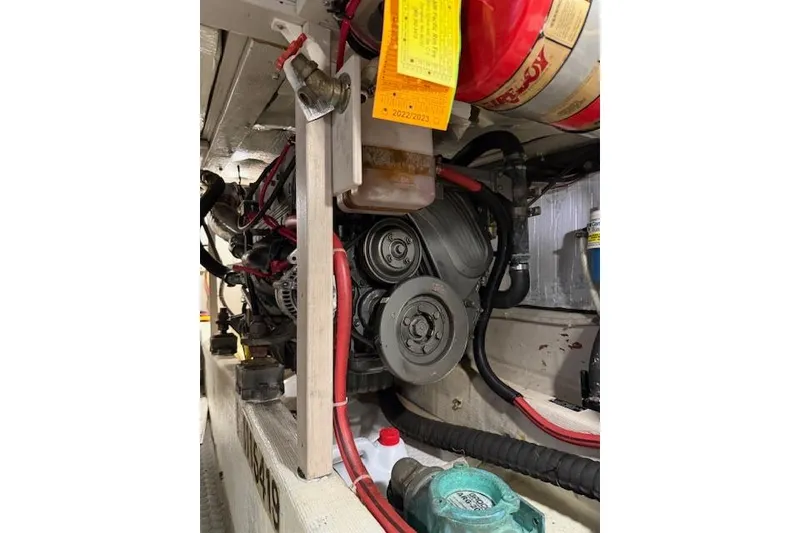 Slide: The Image of Engine compartment of a 2001 Sabreline Sedan with visible components and wiring. - 49