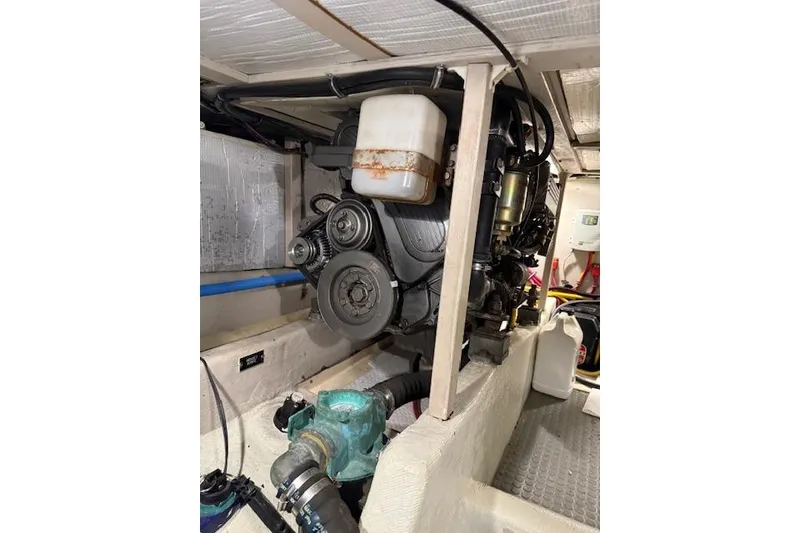 Slide: The Image of Engine compartment of a 2001 Sabreline Sedan, showcasing mechanical components and hoses. - 50